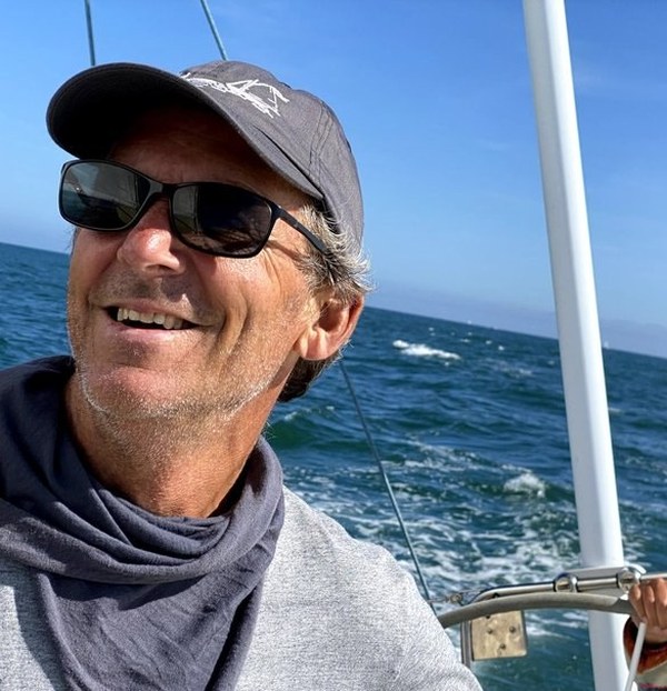 Captain Dale Winson at the helm