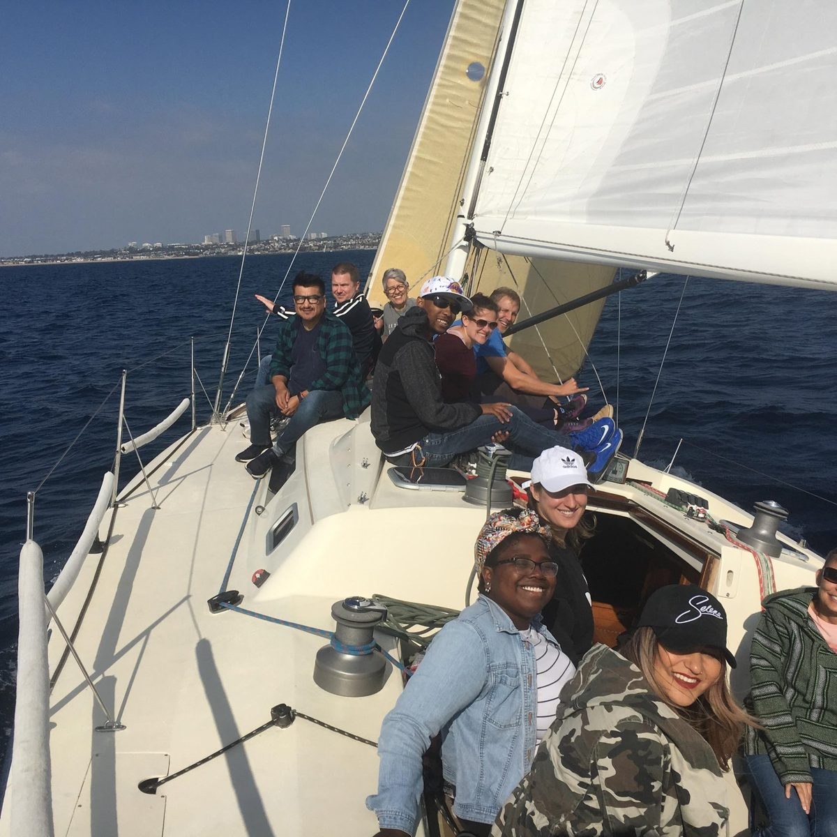 Guests under full sail off Newport Beach